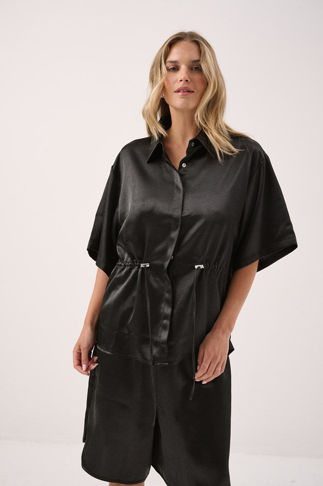 Image of a model wearing Tops. Product name - Kelly Drawstring Collared Shirt Black in Black colour by brand - Sass Clothing