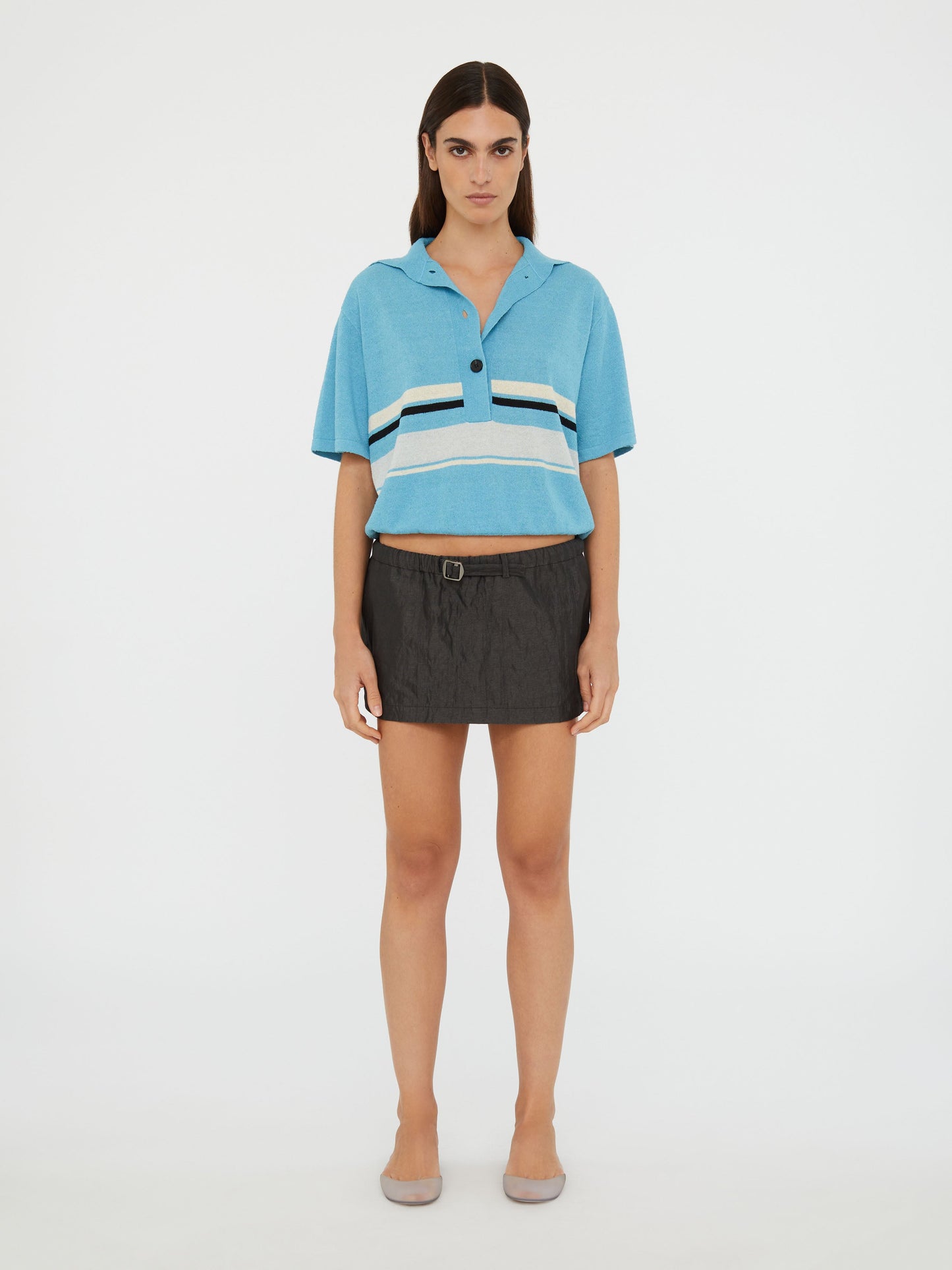 Image of a model wearing Skirts. Productname: Christopher Esber Crushed Belted Mini Skirt in Black colour by brand - Christopher Esber