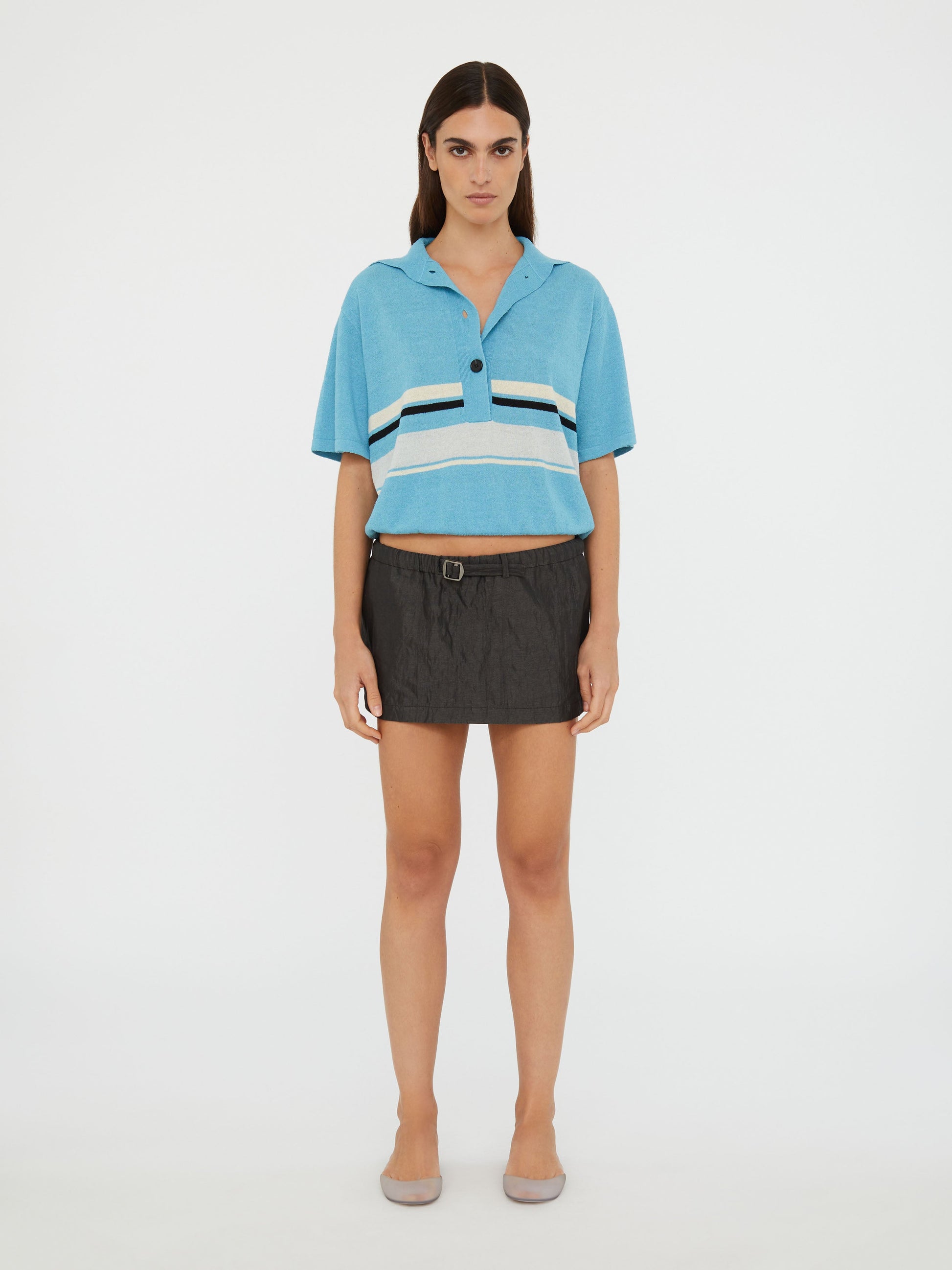 Image of a model wearing Skirts. Productname: Christopher Esber Crushed Belted Mini Skirt in Black colour by brand - Christopher Esber