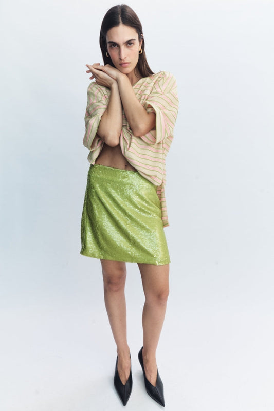 Image of a model wearing Skirts. Product name - Sable Skirt Lime in Lime colour by brand - Blanca Studio
