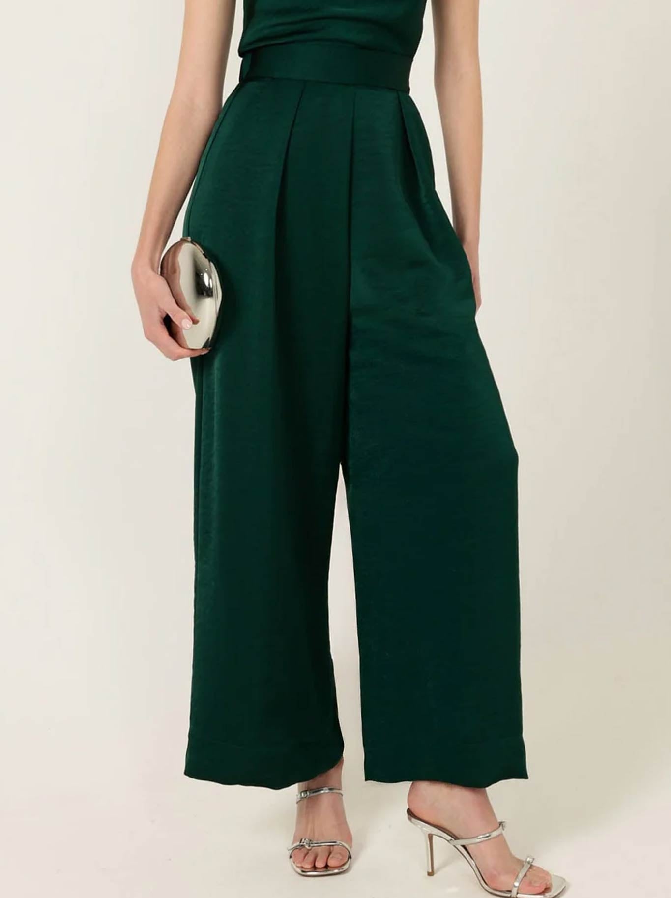 Image of a model wearing Pants. Product name - Sacha Drake Luxe Pleated Trouser in Emerald colour by brand - Sacha Drake Pty Ltd