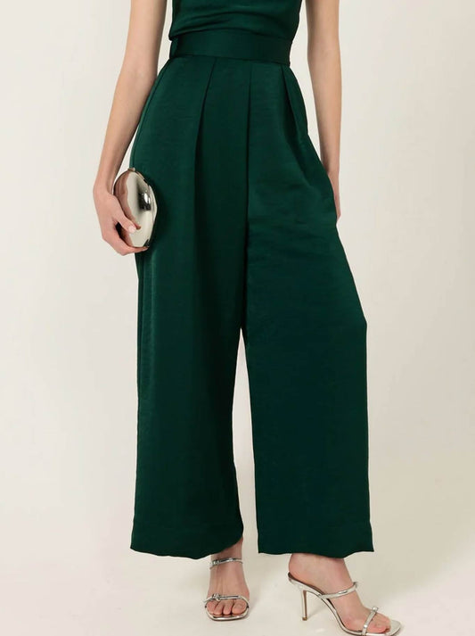 Image of a model wearing Pants. Product name - Sacha Drake Luxe Pleated Trouser in Emerald colour by brand - Sacha Drake Pty Ltd