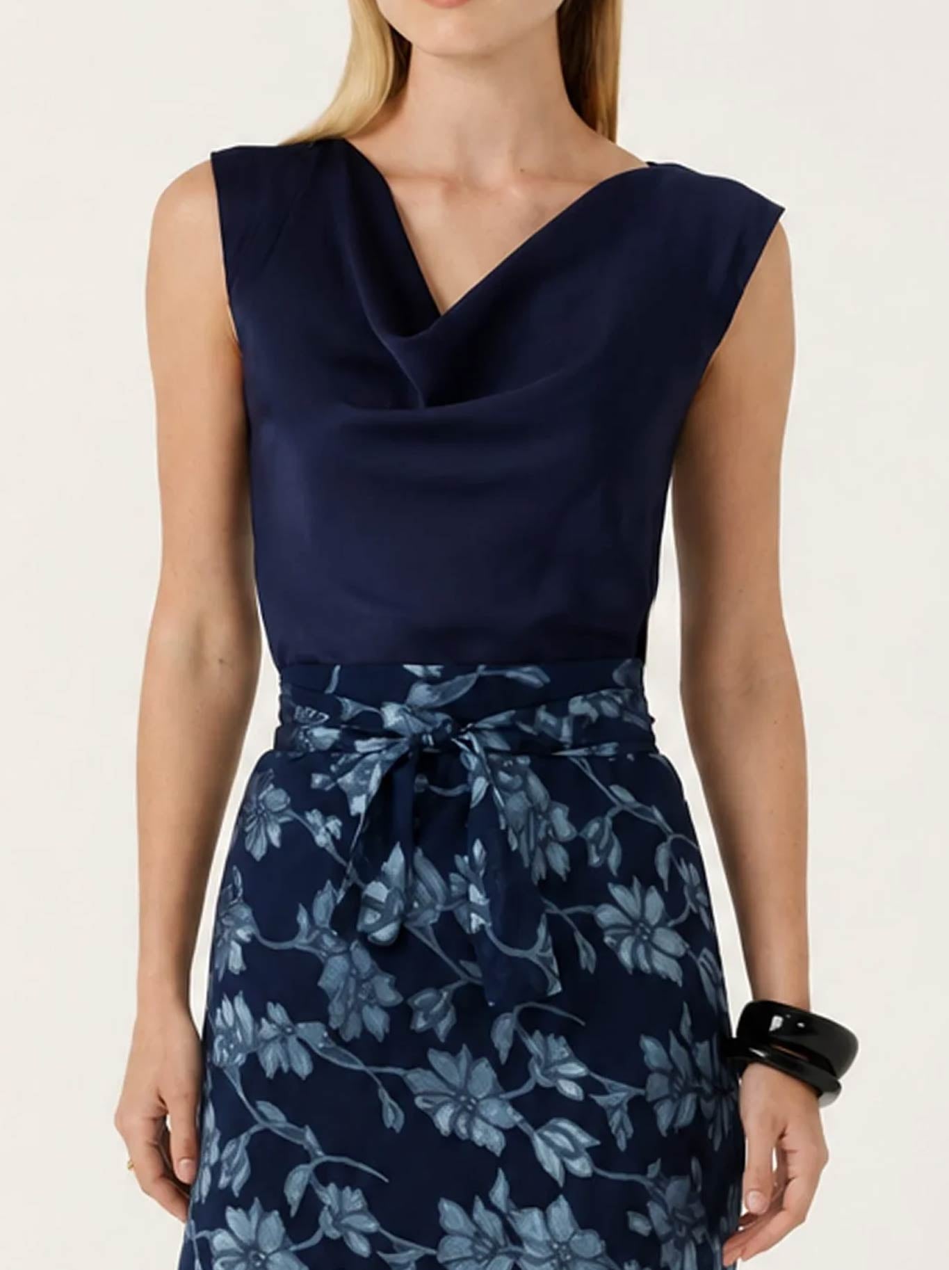 Image of a model wearing Tops. Product name - SACHA DRAKE LUXE COWL BIAS TOP in Navy colour by brand - Sacha Drake