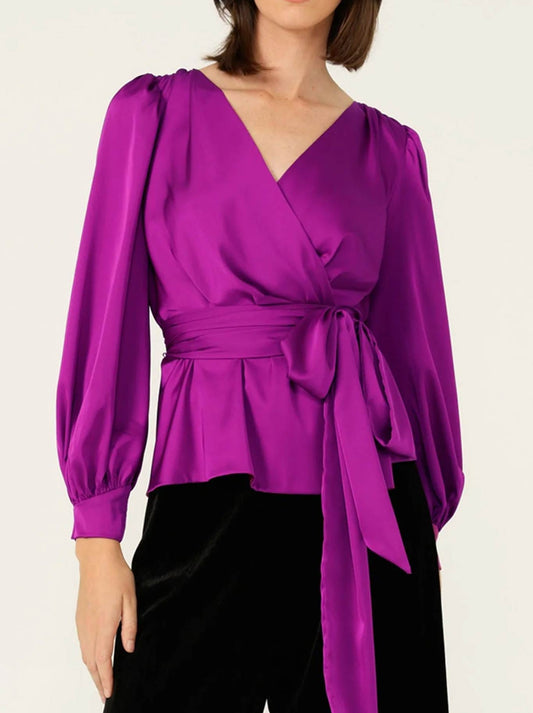 Image of a model wearing Tops. Product name - Sacha Drake Satin Faux Wrap Top in Magenta colour by brand - Sacha Drake