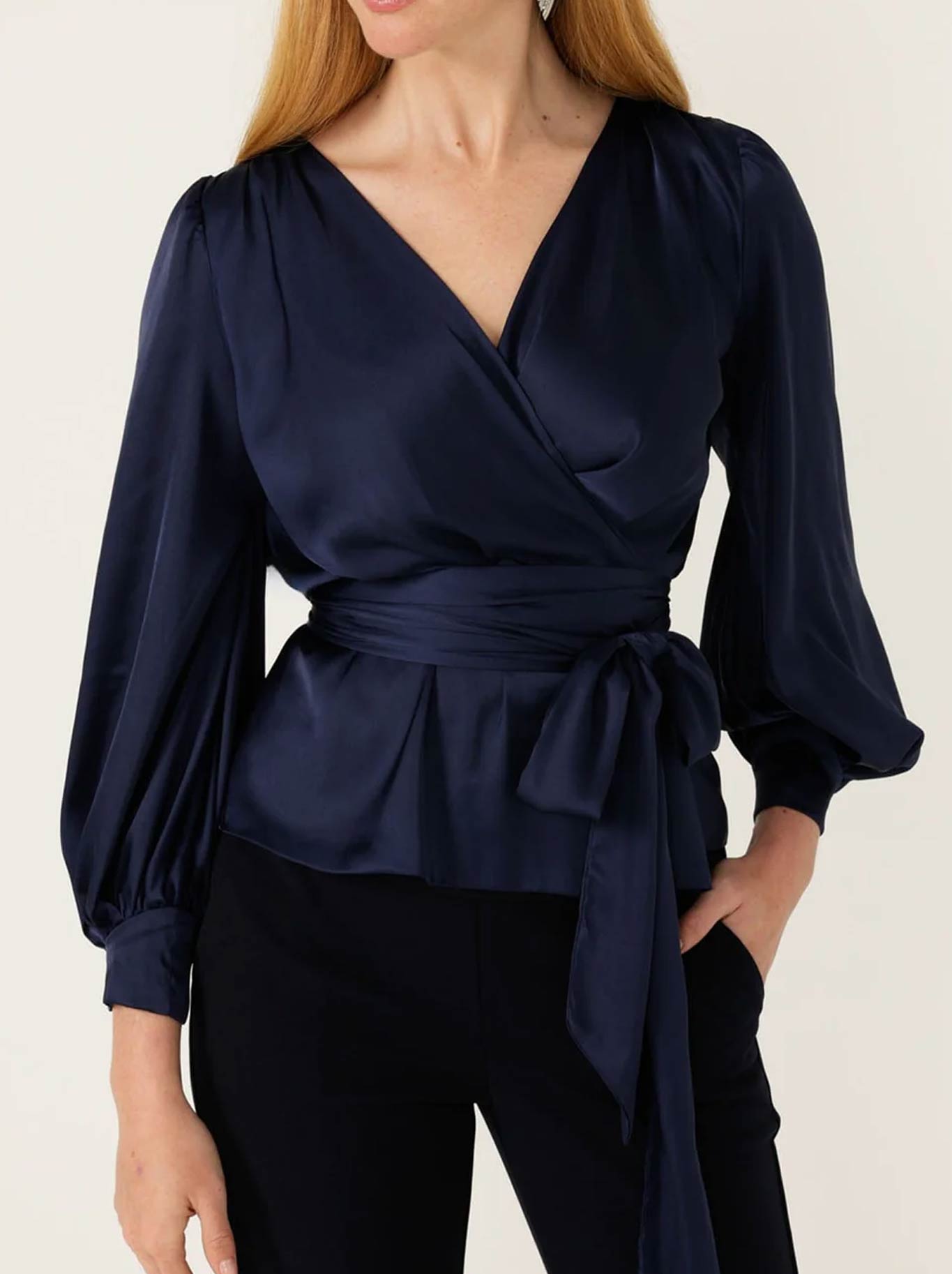 Image of a model wearing Tops. Productname: SACHA DRAKE SATIN FAUX WRAP TOP in Navy colour by brand - Sacha Drake Pty Ltd