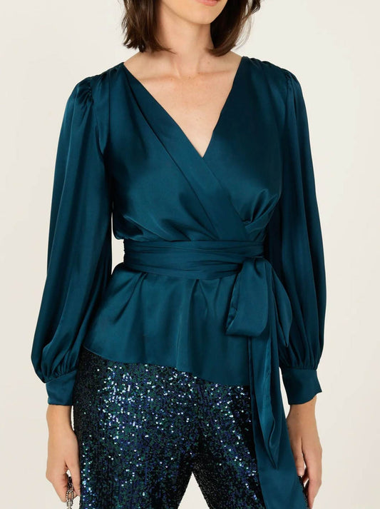 Image of a model wearing Tops. Product name - SACHA DRAKE SATIN FAUX WRAP TOP in Peacock colour by brand - Sacha Drake