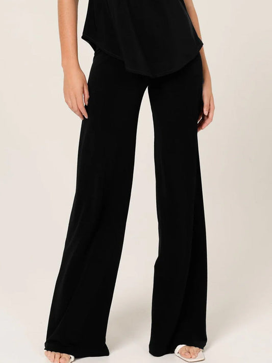 Image of a model wearing Pants. Productname: SACHA DRAKE SEAMLESS PANT in Black colour by brand - Sacha Drake Pty Ltd