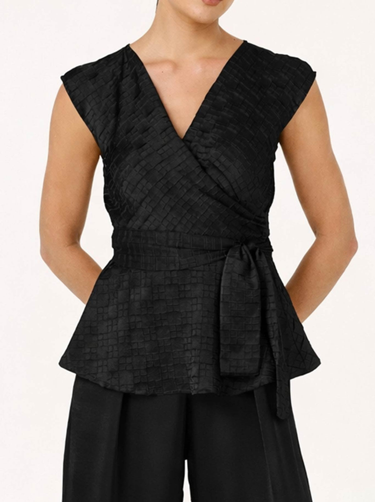 Image of a model wearing Tops. Product name - Sacha Drake Sylvia Top in Black colour by brand - Sacha Drake