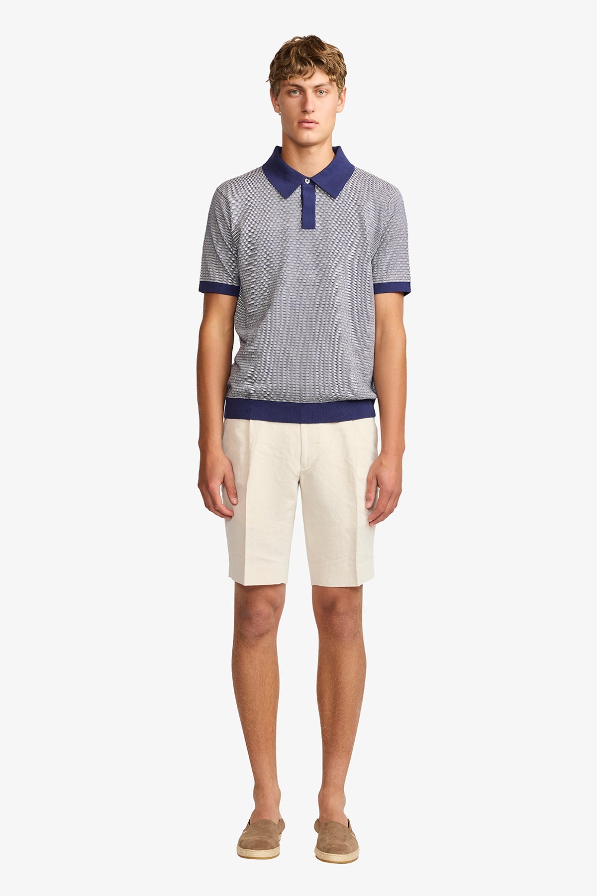 Image of a model wearing Tops. Productname: Anthony Squires Santi blue knitted jacquard S/S polo in Blue colour by brand - Anthony Squires
