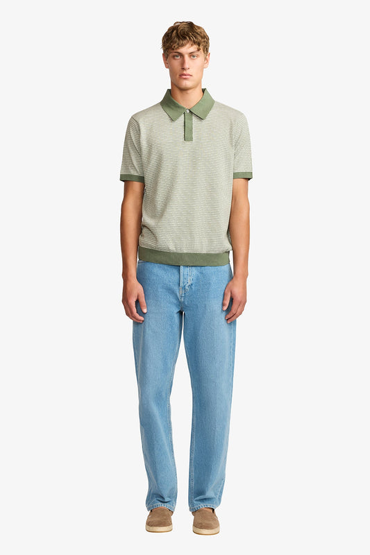 Image of a model wearing Tops. Productname: Anthony Squires Santi olive knitted jacquard S/S polo in Olive colour by brand - Anthony Squires