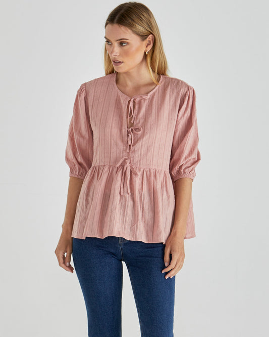 Image of a model wearing Tops. Product name - Rachael Top Pink in Pink colour by brand - Sass Clothing