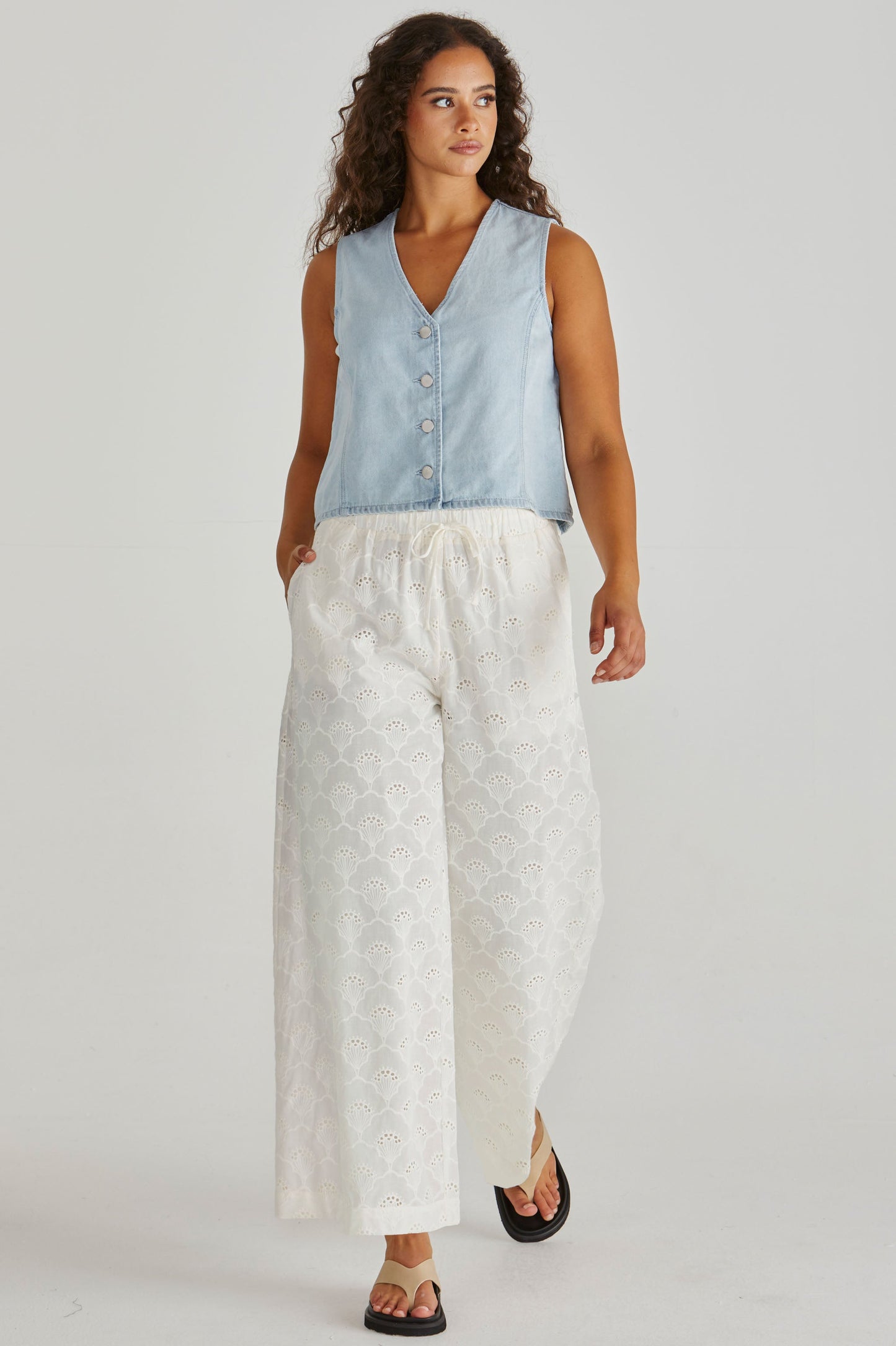 Image of a model wearing Pants. Product name - Zimmy Broderie Pant Cream in Cream colour by brand - Sass Clothing