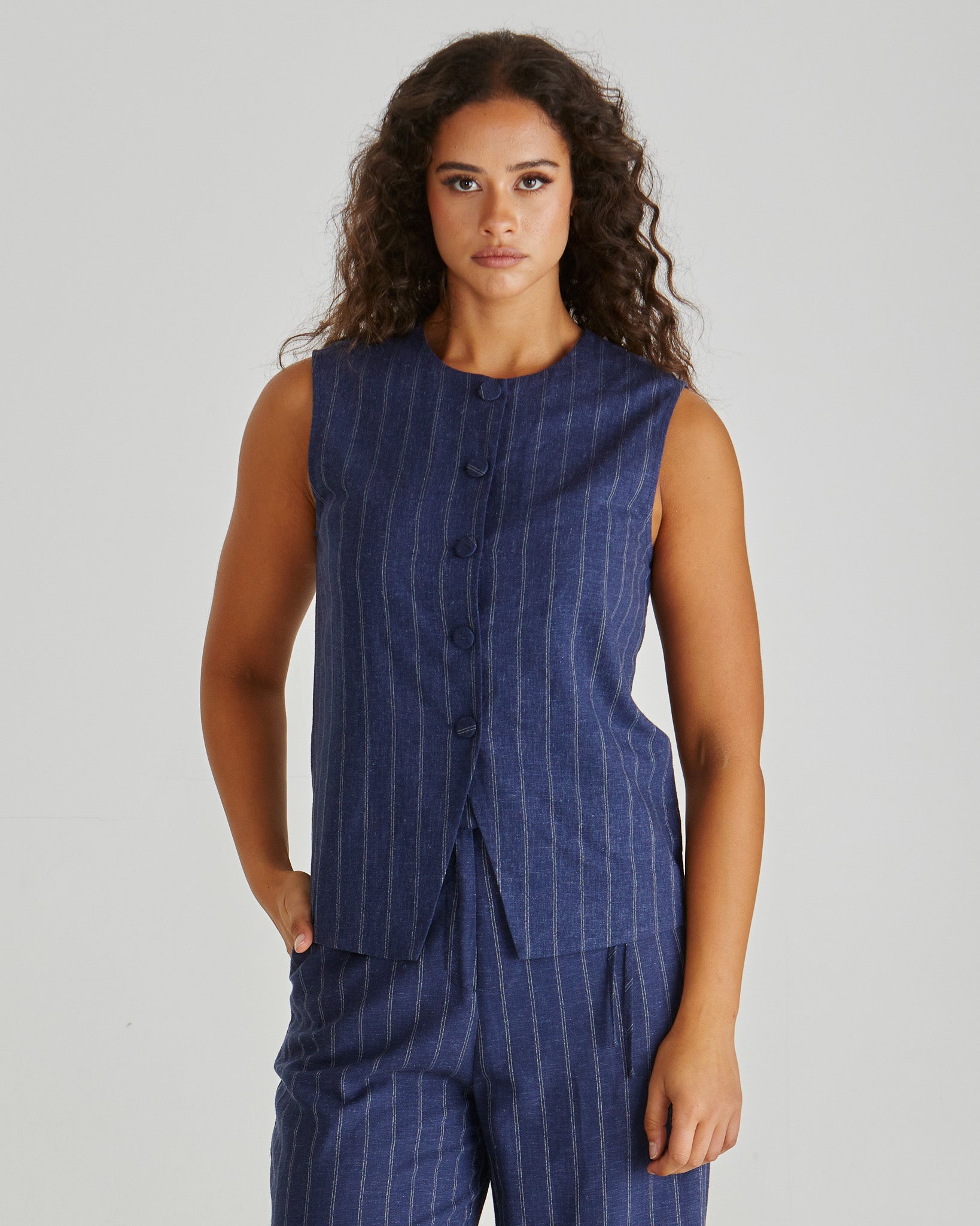 Image of a model wearing Tops. Product name - Petra Vest Navy Pinstripe in Navy Pinstripe colour by brand - Sass Clothing