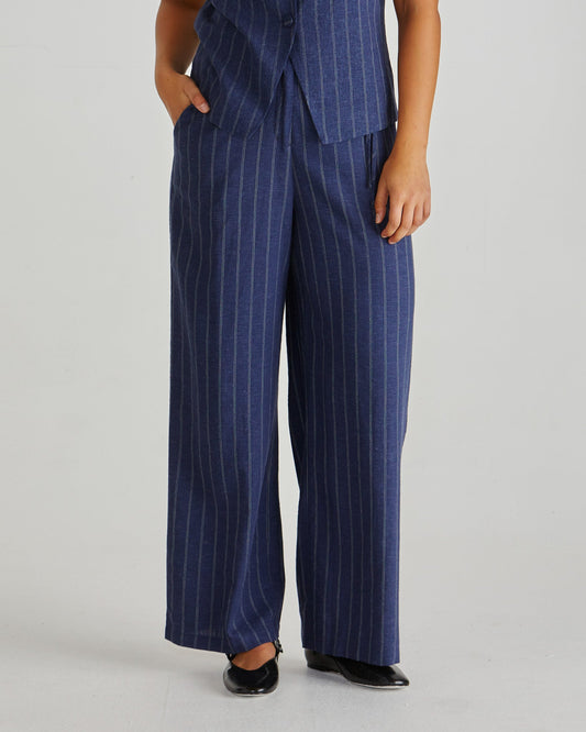 Image of a model wearing Pants. Product name - Petra Pant Navy Pinstripe in Navy Pinstripe colour by brand - Sass Clothing