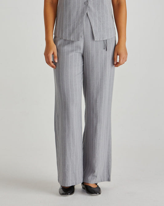 Image of a model wearing Pants. Product name - Petra Pant Grey Pinstripe in Grey Pinstripe colour by brand - Sass Clothing