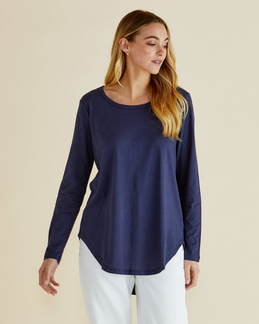 Image of a model wearing Tops. Productname: Betty Basics Megan Long Sleeve Top Navy in Navy colour by brand - Betty Basics