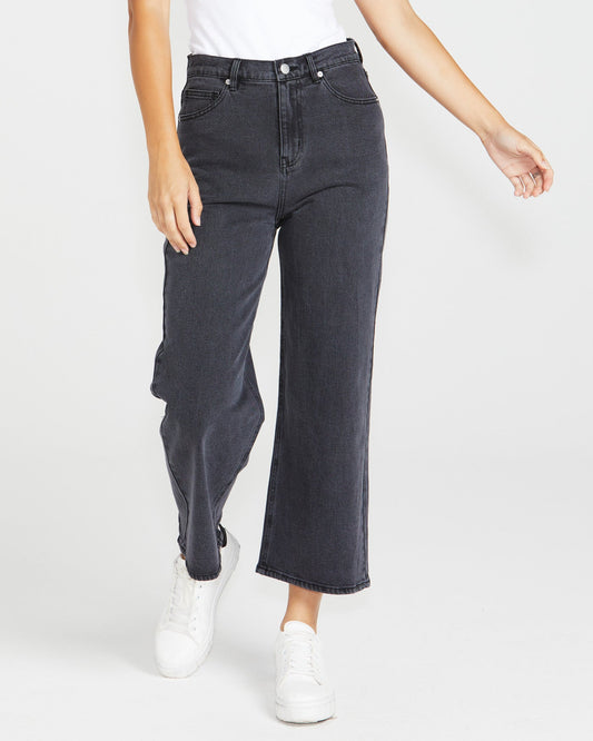 Image of a model wearing Pants. Product name - Sandy Jean 82 Washed Black in 82 Washed Black colour by brand - Sass Clothing