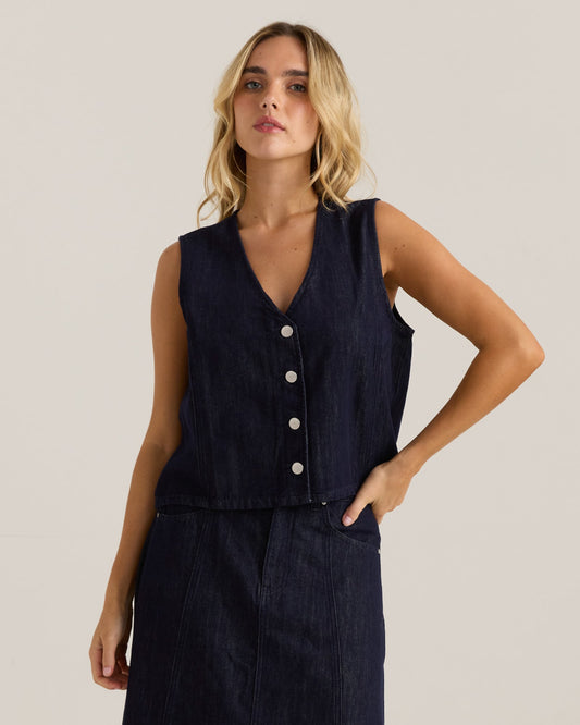 Image of a model wearing Tops. Product name - Sabine Denim Vest Dark Rinse Wash in Dark Rinse Wash colour by brand - Sass Clothing