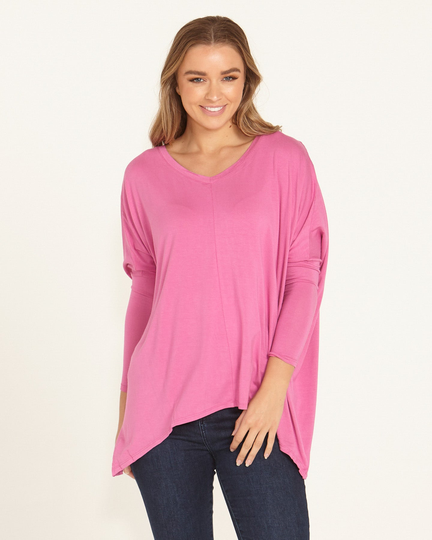 Image of a model wearing Tops. Productname: Betty Basics Kyoto V-Neck Loose Stretchy Basic Tee Winter Pink in Winter Pink colour by brand - Betty Basics