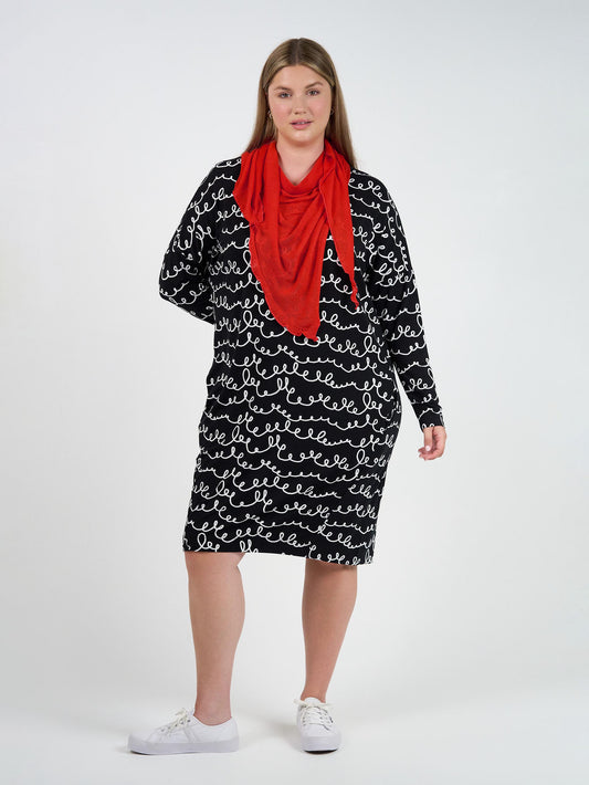Image of a model wearing Tops. Product name - Sassoon Cashmere/Bamboo Scarf Fiery Red in Fiery Red colour by brand - Lou Lou