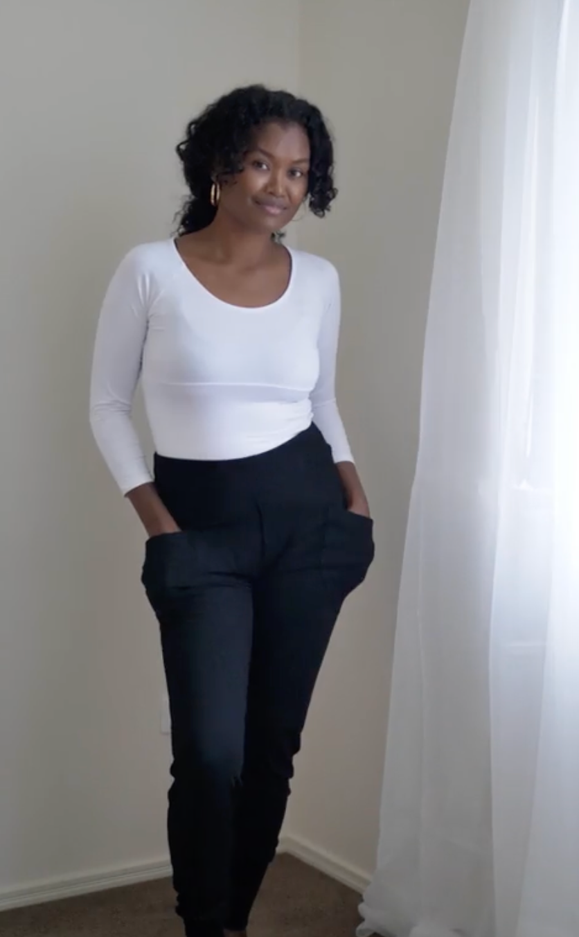 Image of a model wearing Tops. Product name - Ava 3/4 Sleeve Cropped Bamboo Top White in White colour by brand - Lou Lou