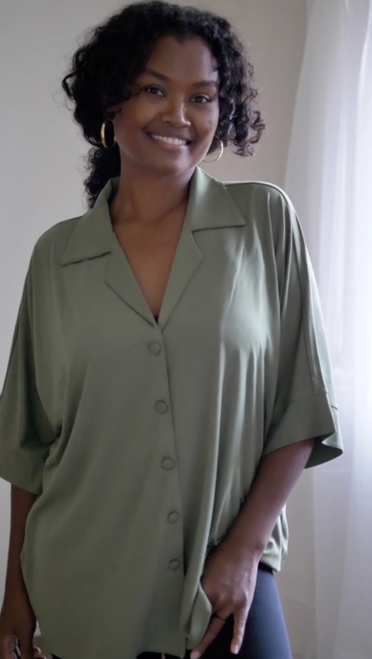Image of a model wearing Tops. Product name - Alanis 3/4 Sleeve Collared Bamboo Shirt Olive in Olive colour by brand - Lou Lou