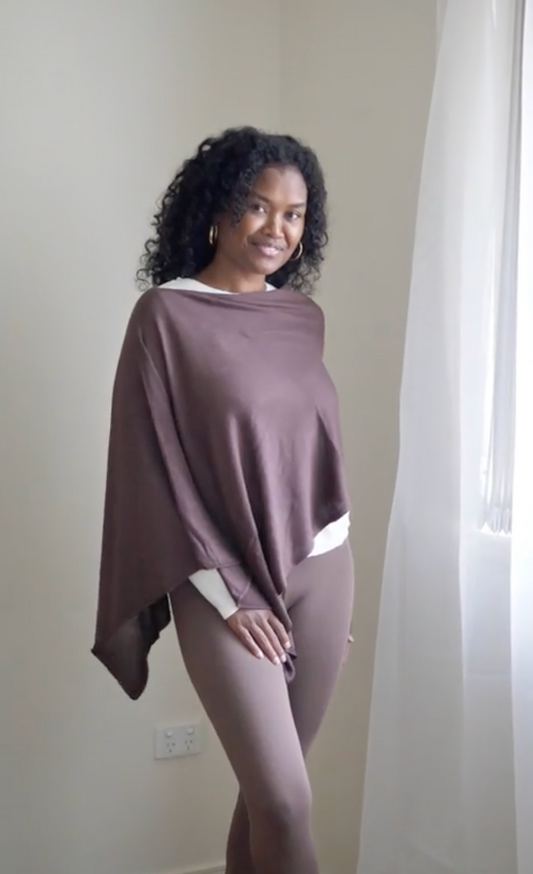 Image of a model wearing Outerwear. Product name - Carrie Cashmere & Bamboo Knit Poncho Chicory Coffee in Chicory Coffee colour by brand - Lou Lou