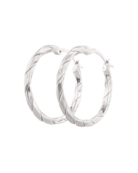 Image of Earrings. Product name - Sculptural Silver Hoop Earrings in colour by brand - LAVANA