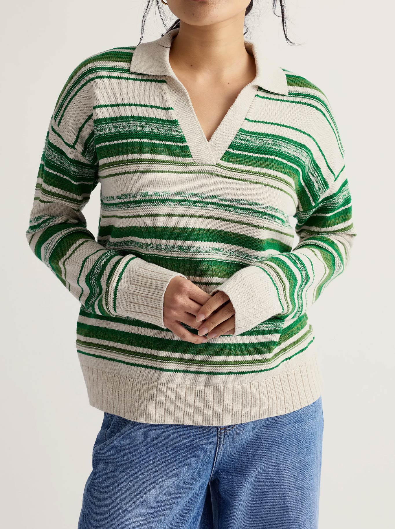 Image of a model wearing Outerwear. Product name - Seasalt Bird Flight Jumper in Corula Chalk Bright Green colour by brand - Seasalt
