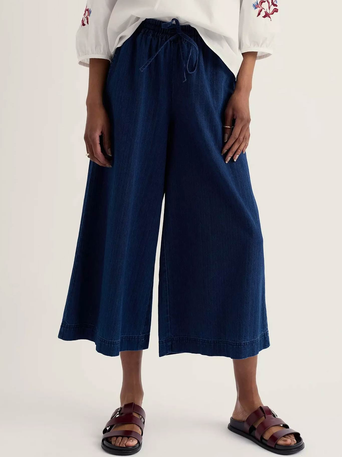 Image of a model wearing Pants. Product name - Seasalt Eskelli Culotte in Mid Wash colour by brand - Seasalt