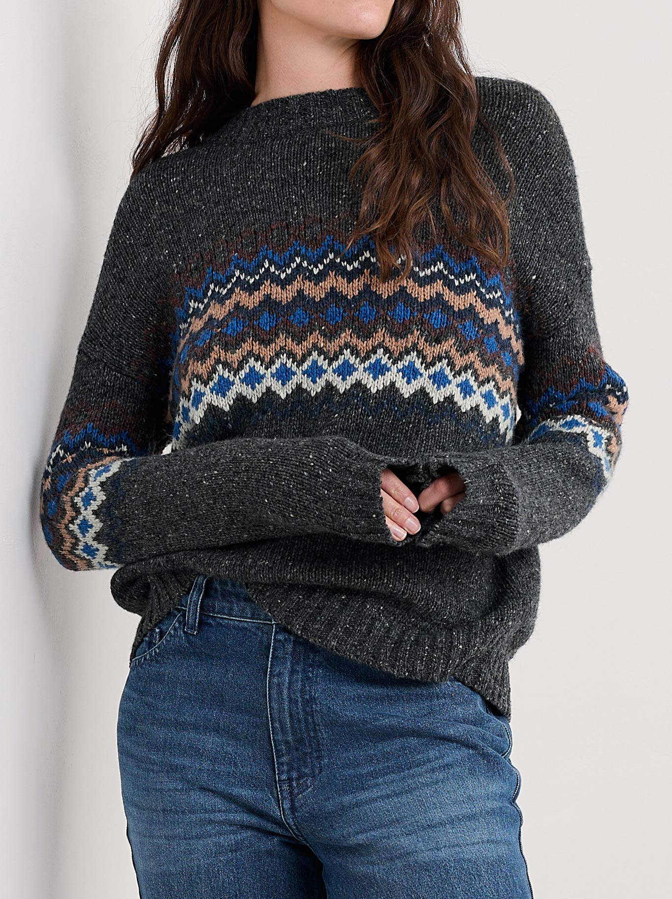 Image of a model wearing Outerwear. Product name - Seasalt Golden Light Jumper in Coal Jetty Mix colour by brand - Seasalt