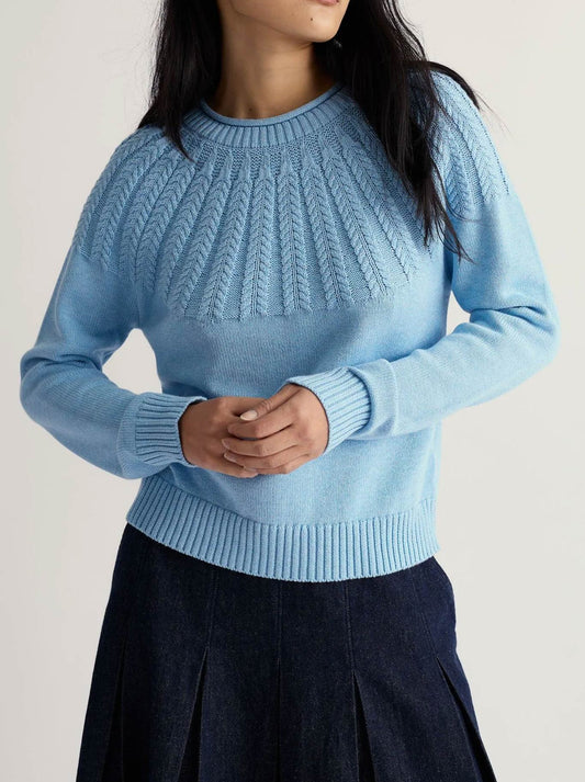 Image of a model wearing Outerwear. Product name - Seasalt Stone Chat Jumper in Spring Sky colour by brand - Seasalt