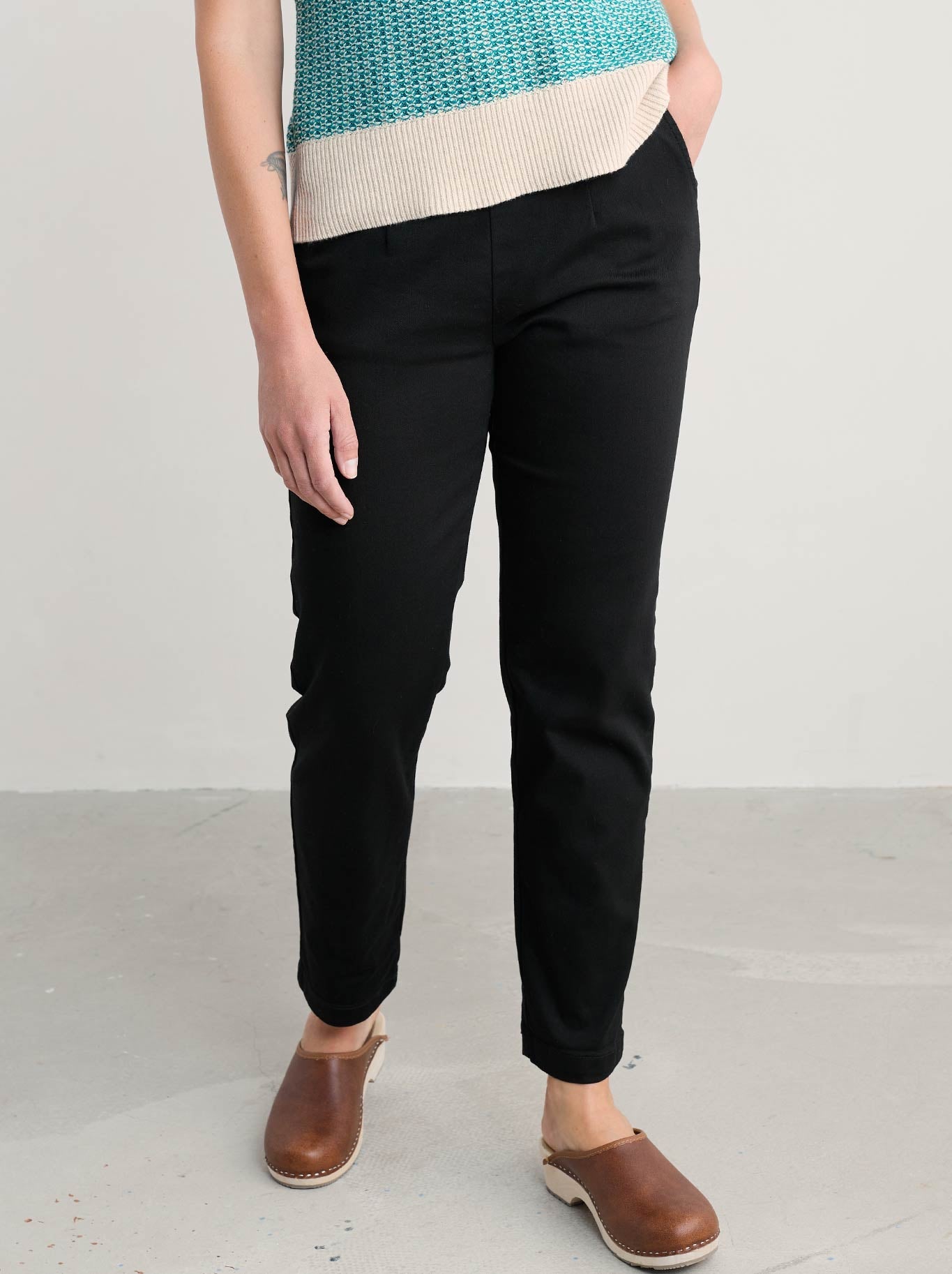 Image of a model wearing Pants. Product name - Seasalt Waterdance Trouser in Black colour by brand - Seasalt