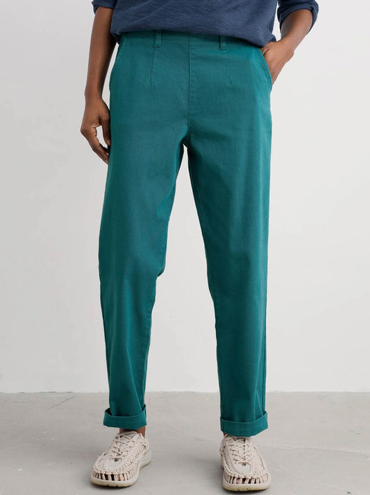 Image of a model wearing Pants. Product name - Seasalt Waterdance Trouser in Kingfisher colour by brand - Seasalt