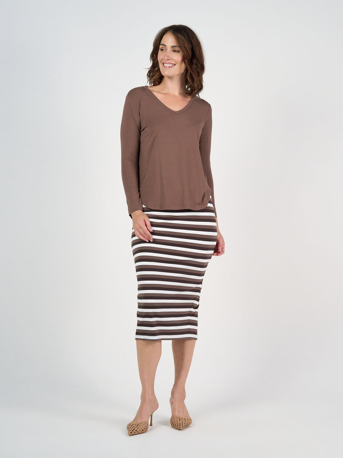 Image of a model wearing Tops. Product name - Sia V Neck Bamboo Longsleeve Top Chocolate in Chocolate colour by brand - Lou Lou