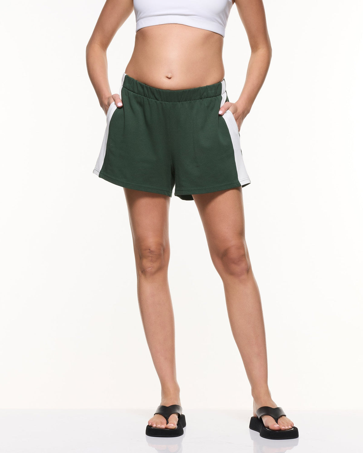 Image of a model wearing Shorts. Product name - Side Stripe Cotton Shorts in colour by brand - Soon Maternity