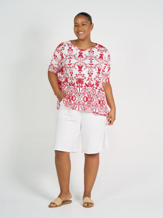 Image of a model wearing Tops. Product name - Gina Oversized Slouch Bamboo T-Shirt Lipstick Palm in Lipstick Palm colour by brand - Lou Lou