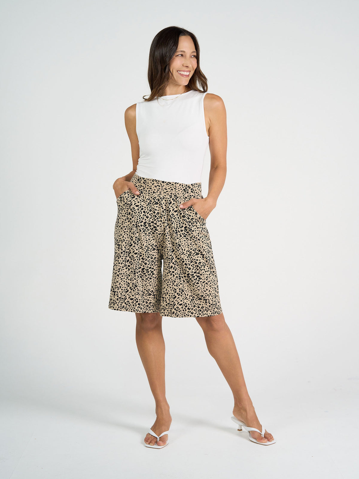 Image of a model wearing Tops. Product name - Kate Bamboo Tank White in White colour by brand - Lou Lou