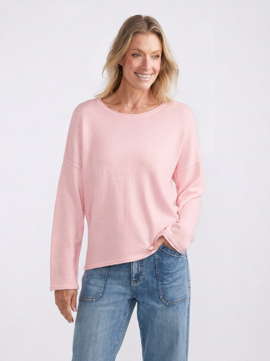 Image of a model wearing Outerwear. Product name - Sorrento Raw Edge Knit Ice Pink in Ice Pink colour by brand - White & Co.