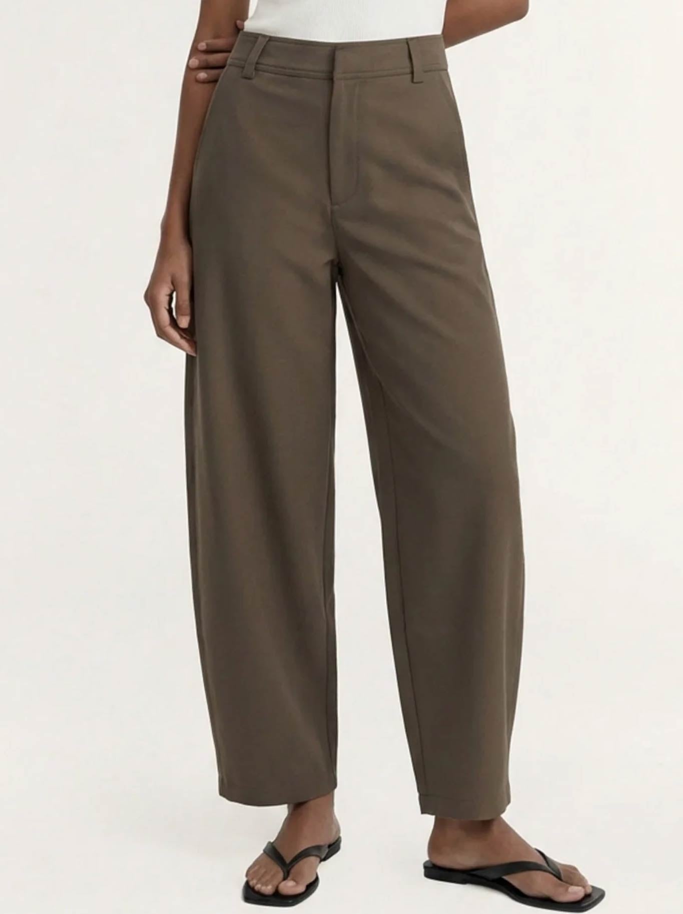 Image of a model wearing Pants. Product name - Staple The Label Alto Barrell Pant in Olive colour by brand - Staple