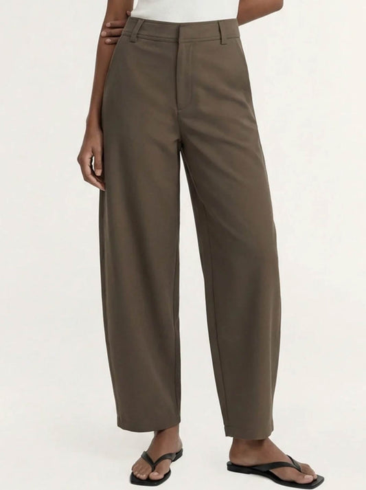 Image of a model wearing Pants. Product name - Staple The Label Alto Barrell Pant in Olive colour by brand - Staple