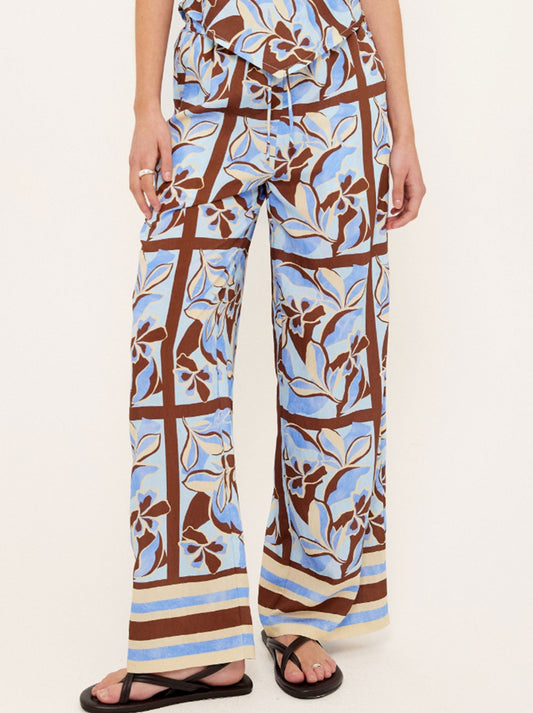 Image of a model wearing Pants. Productname: STAPLE THE LABEL CIELO DRAWSTING PANTS in Abstract colour by brand - Staple
