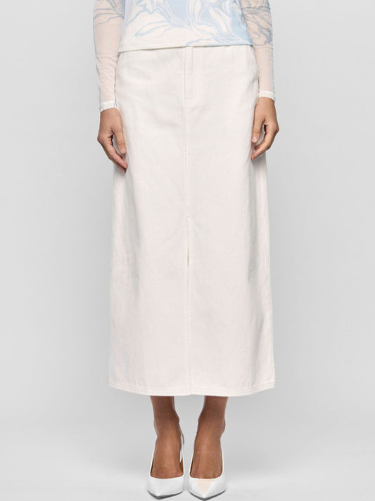 Image of a model wearing Skirts. Productname: STAPLE THE LABEL EMMIE DENIM MIDI SKIRT in White colour by brand - Staple
