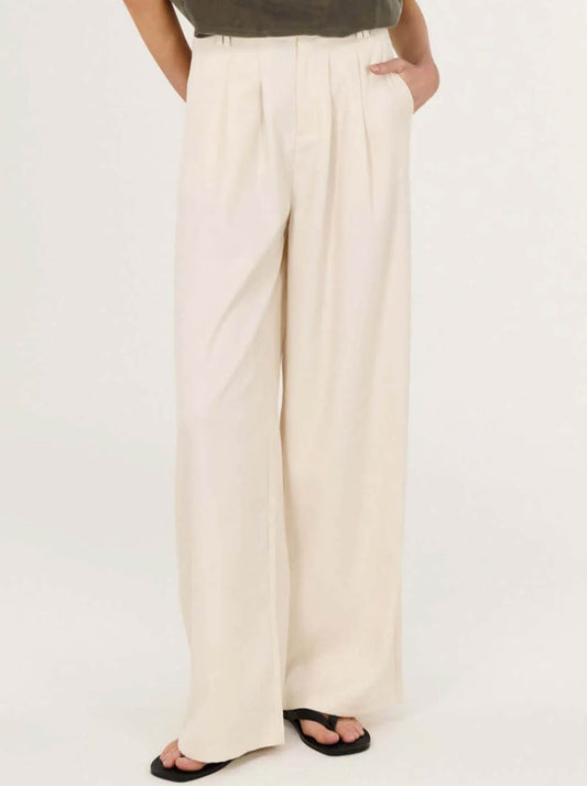 Image of a model wearing Pants. Productname: STAPLE THE LABEL SABLE HIGH WAIST PANT in Oat colour by brand - Staple