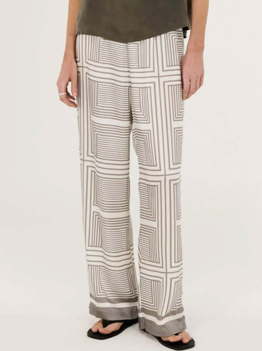 Image of a model wearing Pants. Productname: STAPLE THE LABEL SIPHON RELAXED PANT in Geometric colour by brand - Staple