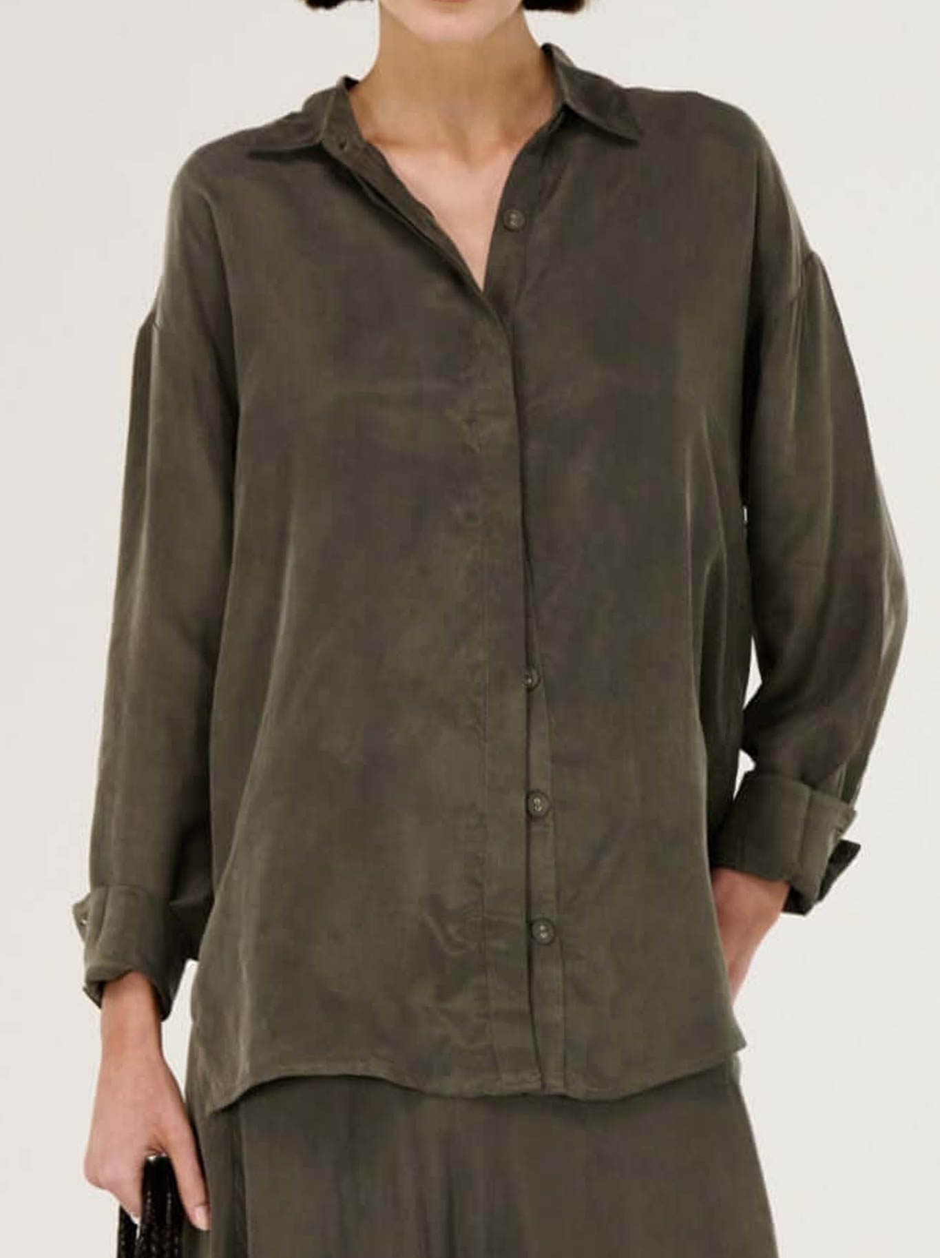Image of a model wearing Tops. Productname: STAPLE THE LABEL STEVIE LONG SLEEVE SHIRT in Olive colour by brand - Staple