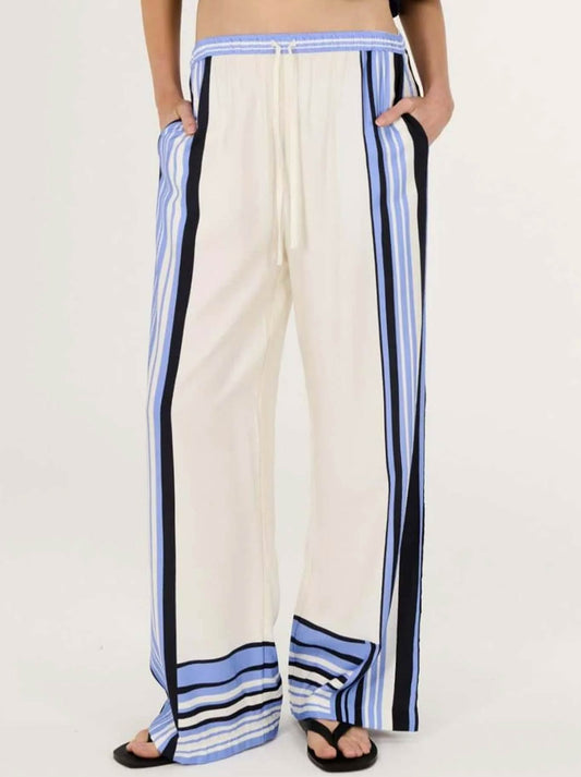 Image of a model wearing Pants. Productname: STAPLE THE LABEL AMARI RELAXED PANT in Stripe colour by brand - Staple