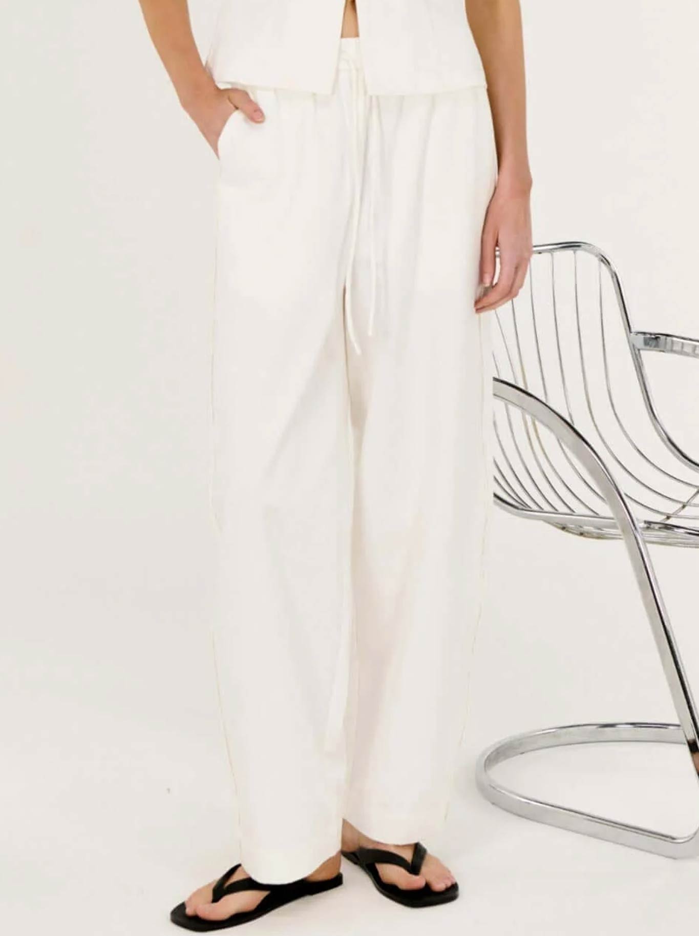 Image of a model wearing Pants. Productname: STAPLE THE LABEL PORTIA PANT in White colour by brand - Staple