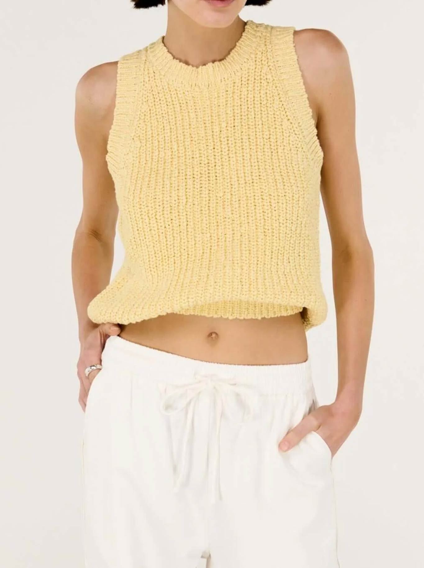 Image of a model wearing Tops. Productname: STAPLE THE LABEL COVE KNIT TANK in Butter colour by brand - Staple