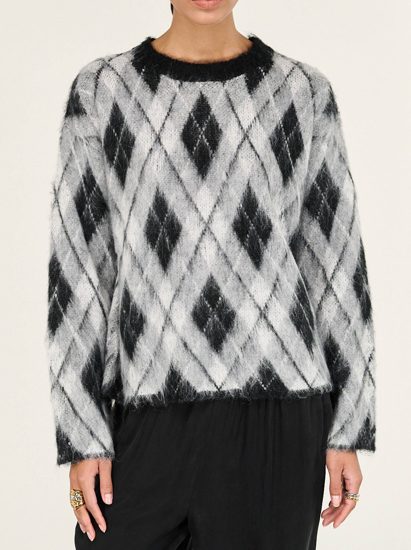 Image of a model wearing Outerwear. Product name - STAPLE THE LABEL CAMILLE BRUSHED JUMPER in Check colour by brand - Staple